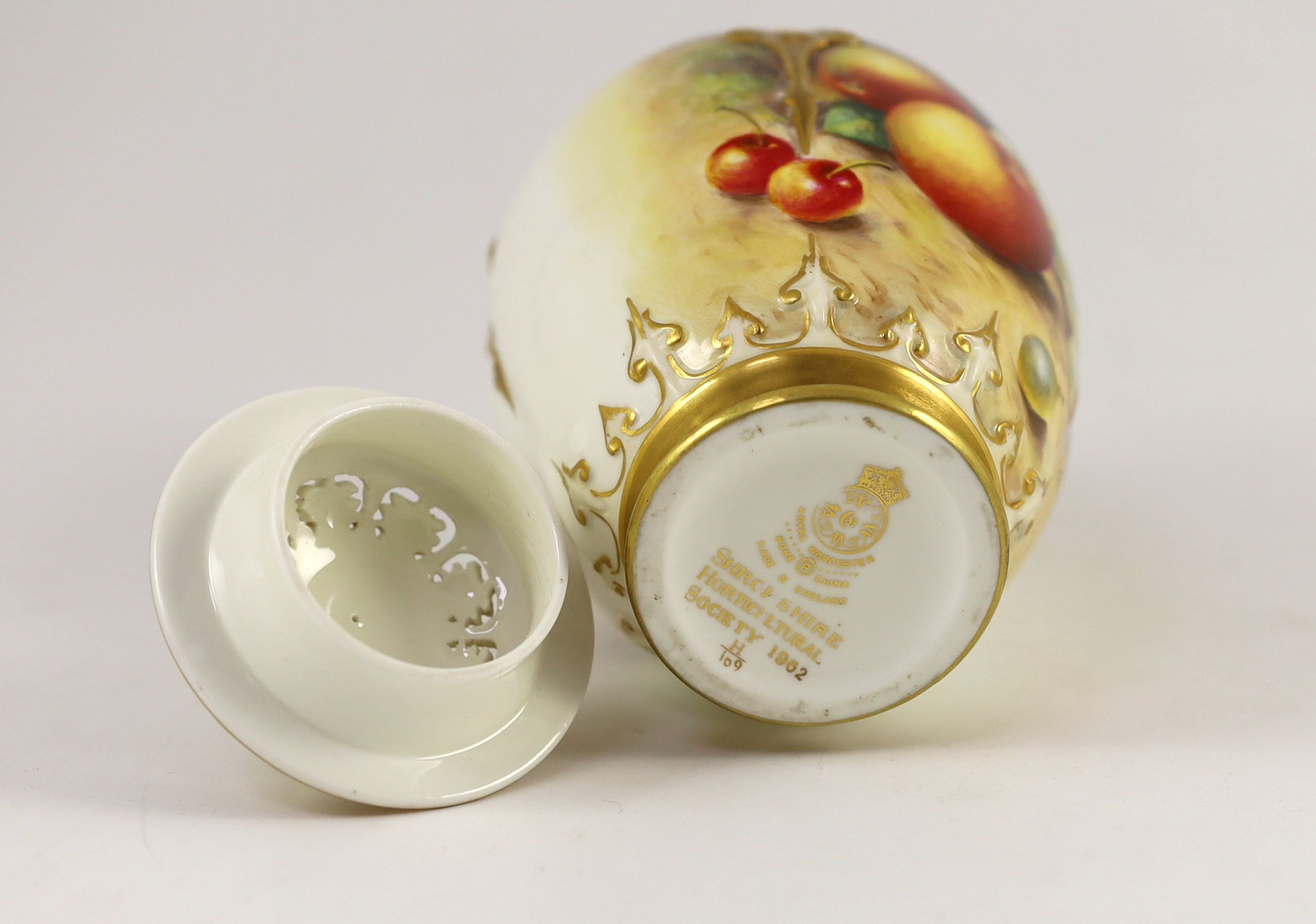 A Royal Worcester fruit painted vase and cover, by John Freeman, c.1962, 19cm high